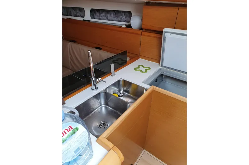  Yacht Photos Pics Interior of 2013 Jeanneau Sun Odyssey 409 yacht, featuring a modern kitchen area.