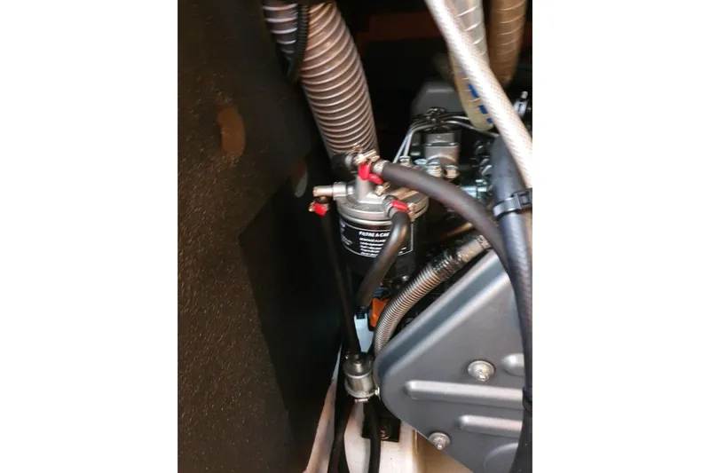  Yacht Photos Pics Engine compartment of a 2013 Jeanneau Sun Odyssey 409 sailboat, showing hoses and components.