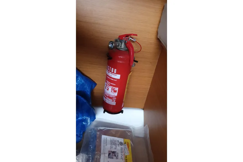 Yacht Photos Pics Red fire extinguisher on Jeanneau Sun Odyssey 409 yacht, 2013 model.
