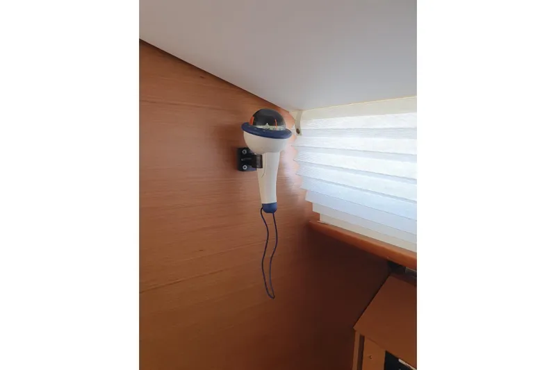  Yacht Photos Pics Wall-mounted light fixture inside 2013 Jeanneau Sun Odyssey 409 yacht cabin.