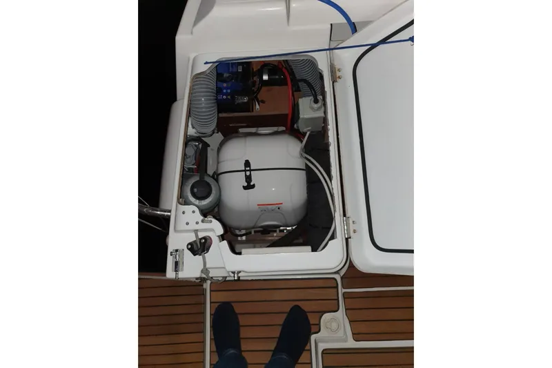  Yacht Photos Pics Engine compartment of 2013 Jeanneau Sun Odyssey 409 sailboat, showing mechanical components.