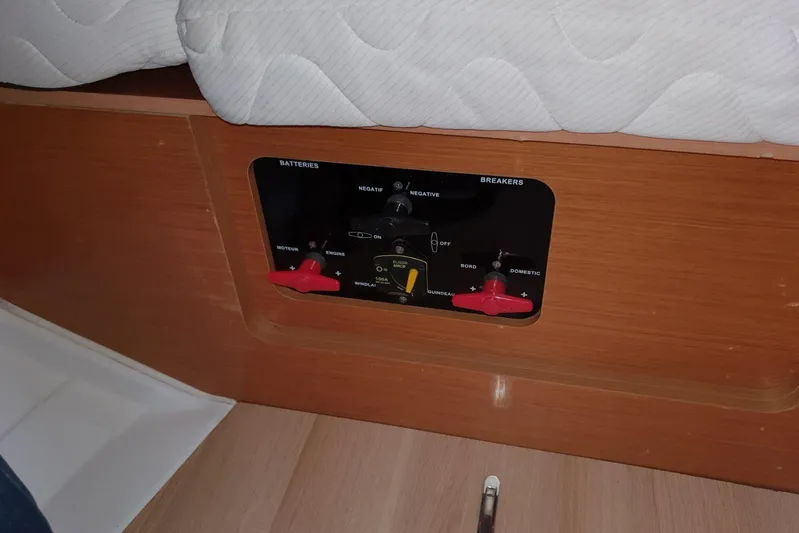  Yacht Photos Pics Control panel on a 2013 Jeanneau Sun Odyssey 409 sailboat, featuring battery and breaker switches.