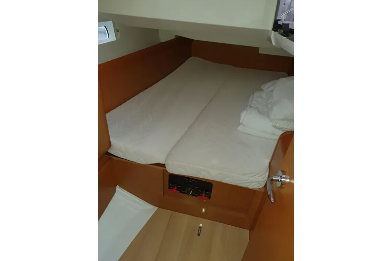  Yacht Photos Pics Cozy cabin interior of 2013 Jeanneau Sun Odyssey 409 sailboat.