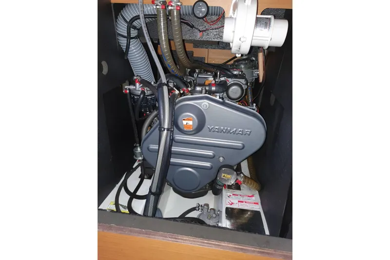  Yacht Photos Pics Engine compartment of a 2013 Jeanneau Sun Odyssey 409 sailboat, featuring a Yanmar engine.
