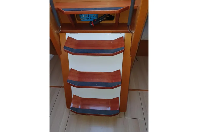  Yacht Photos Pics Wooden steps inside a 2013 Jeanneau Sun Odyssey 409 sailboat.