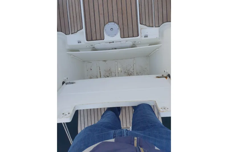  Yacht Photos Pics Person standing on Jeanneau Sun Odyssey 409 sailboat deck, 2013 model.