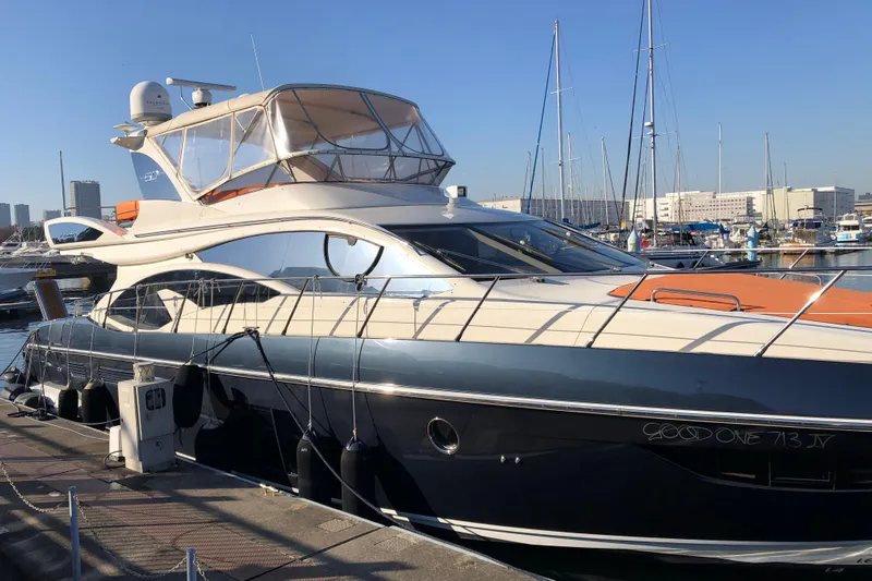  Yacht Photos Pics 2014 Azimut Fly 60 yacht docked at a marina under clear blue skies.