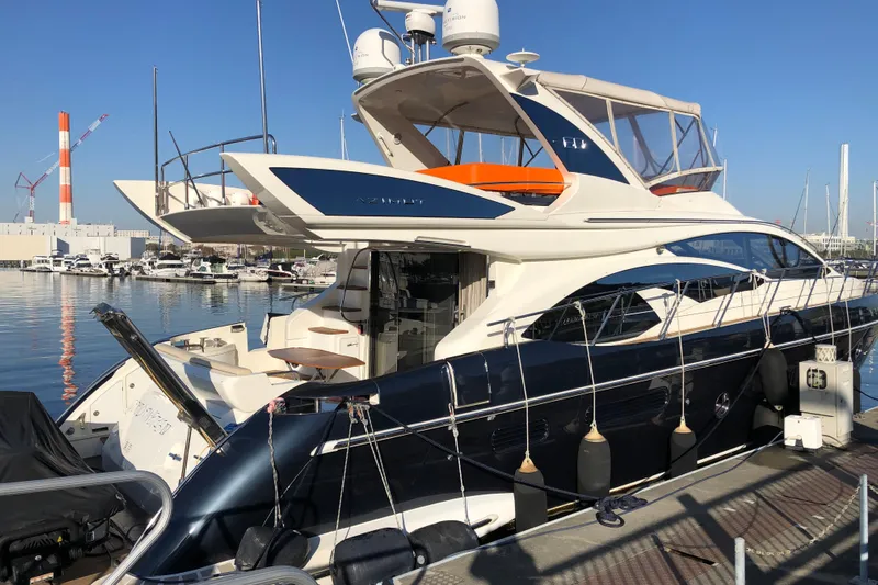  Yacht Photos Pics Azimut Fly 60 yacht, 2014 model, docked at a marina under clear blue skies.