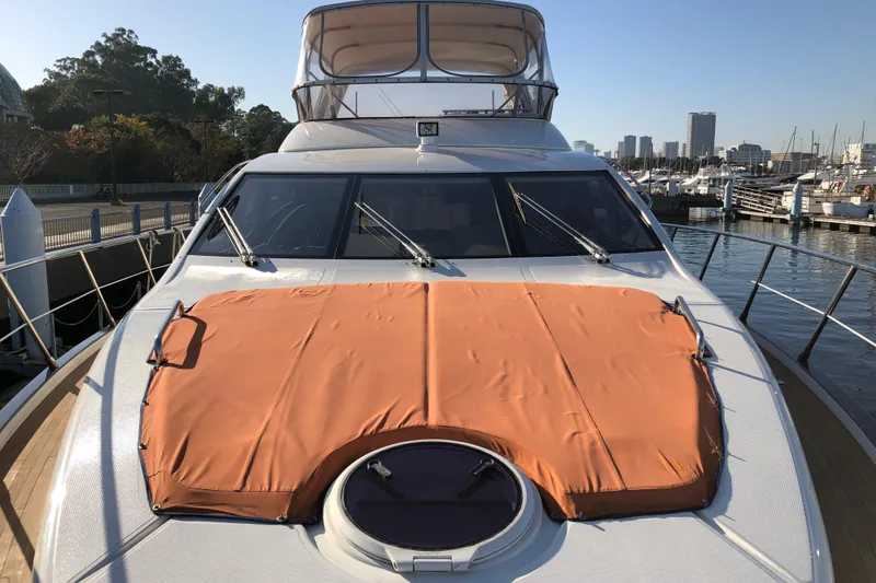  Yacht Photos Pics 2014 Azimut Fly 60 yacht docked at marina, featuring orange sunpad cover.
