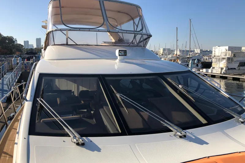  Yacht Photos Pics Azimut Fly 60 yacht, 2014 model, docked at a marina under clear blue skies.