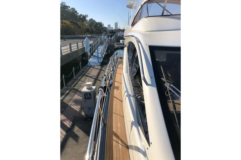  Yacht Photos Pics 2014 Azimut Fly 60 yacht docked at a marina, side view.