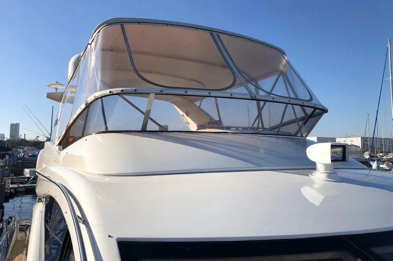  Yacht Photos Pics 2014 Azimut Fly 60 yacht with enclosed flybridge, docked at marina.