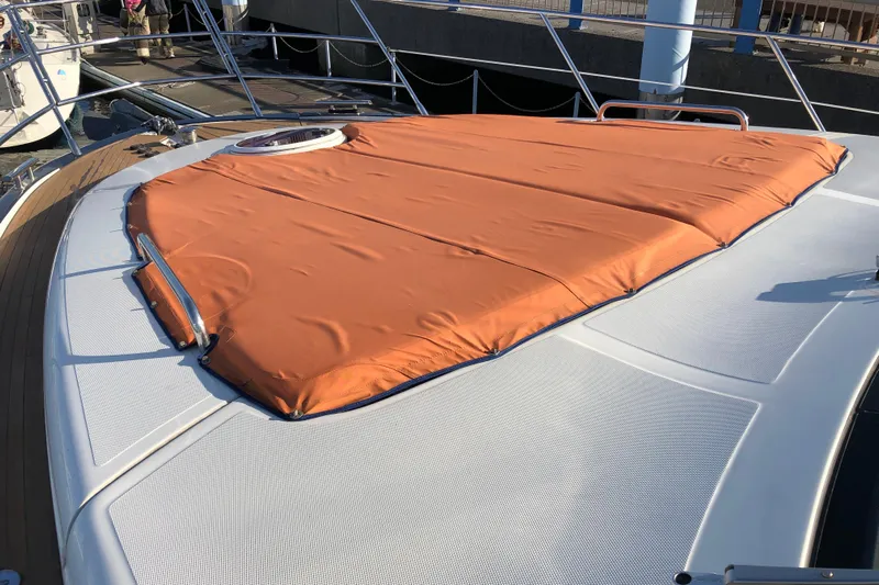  Yacht Photos Pics 2014 Azimut Fly 60 yacht with orange sunpad cover on deck.