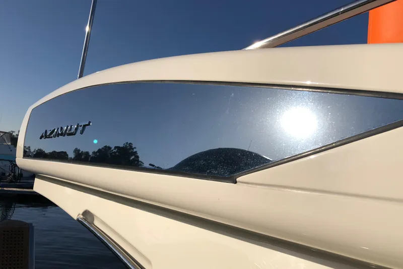  Yacht Photos Pics Close-up of 2014 Azimut Fly 60 yacht reflecting sunlight on water.