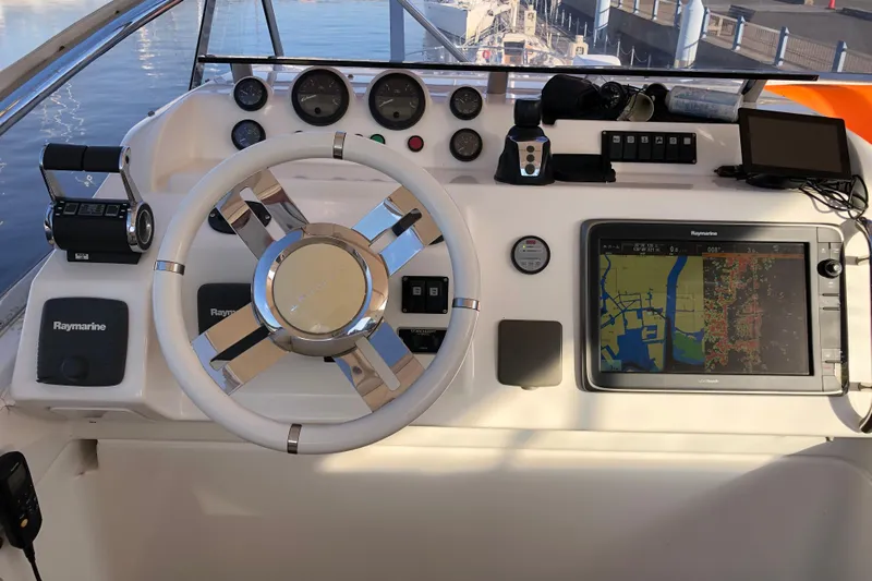  Yacht Photos Pics Cockpit of 2014 Azimut Fly 60 yacht with navigation equipment and steering wheel.