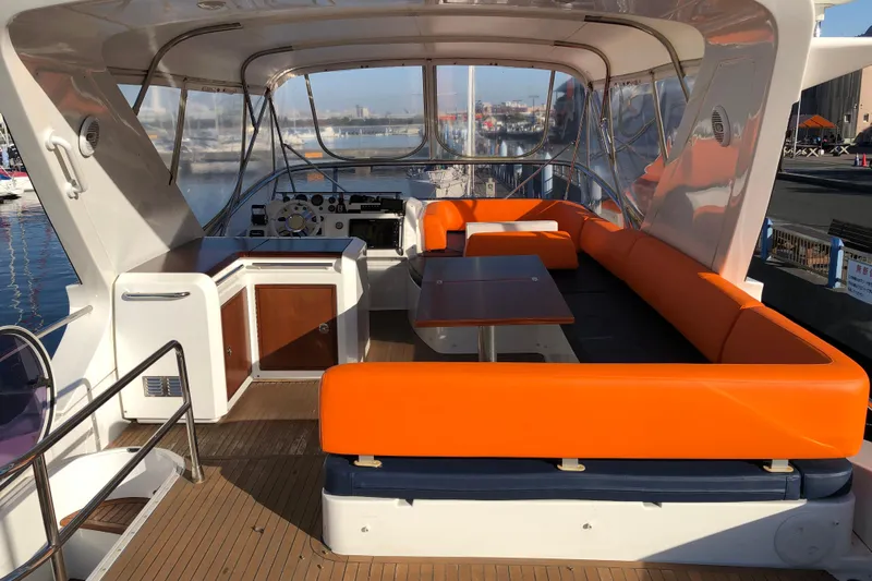  Yacht Photos Pics Luxurious 2014 Azimut Fly 60 yacht interior with vibrant orange seating and sleek design.