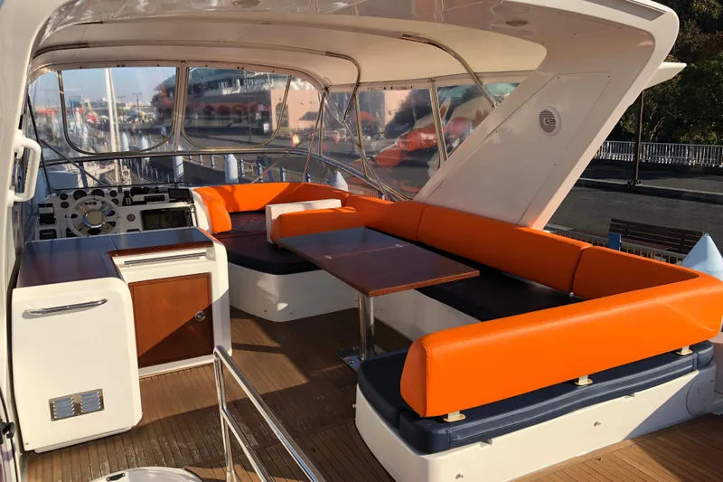  Yacht Photos Pics Luxurious 2014 Azimut Fly 60 yacht interior with vibrant orange seating and sleek design.