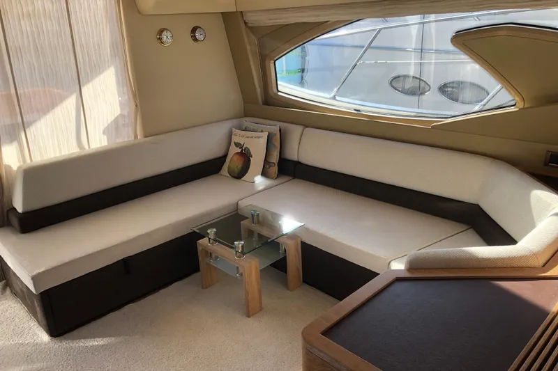  Yacht Photos Pics Luxurious interior of 2014 Azimut Fly 60 yacht with elegant seating and glass table.
