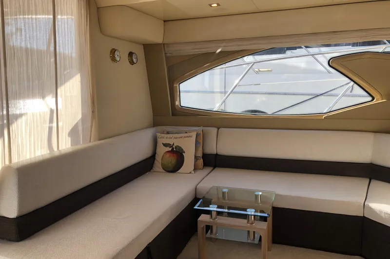  Yacht Photos Pics Luxurious interior of 2014 Azimut Fly 60 yacht with elegant seating and glass table.