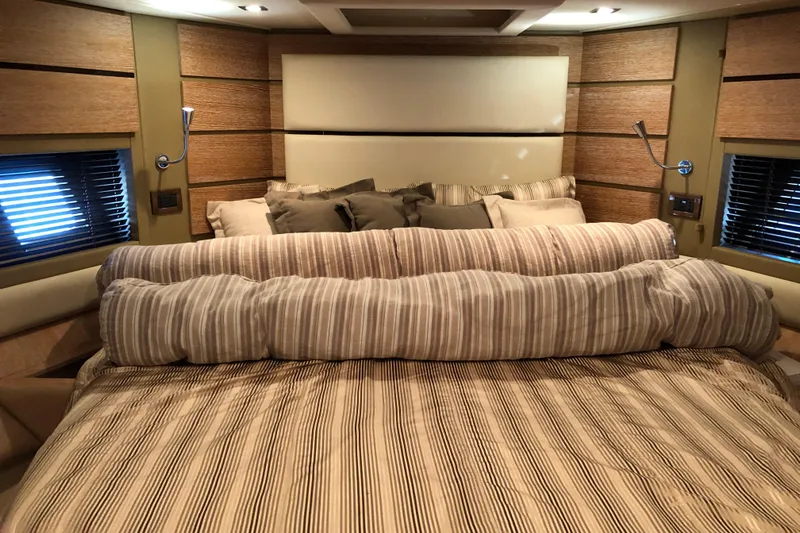  Yacht Photos Pics Luxurious bedroom interior of 2014 Azimut Fly 60 yacht with striped bedding.