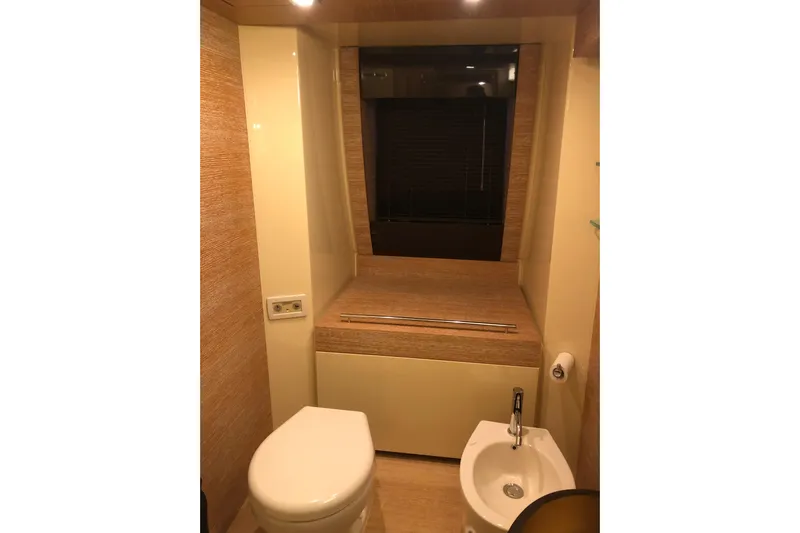  Yacht Photos Pics Luxurious bathroom in 2014 Azimut Fly 60 yacht with modern fixtures and elegant design.