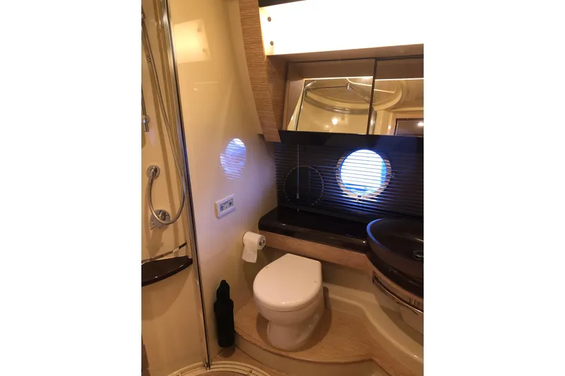  Yacht Photos Pics Luxurious bathroom in 2014 Azimut Fly 60 yacht with modern fixtures and porthole window.