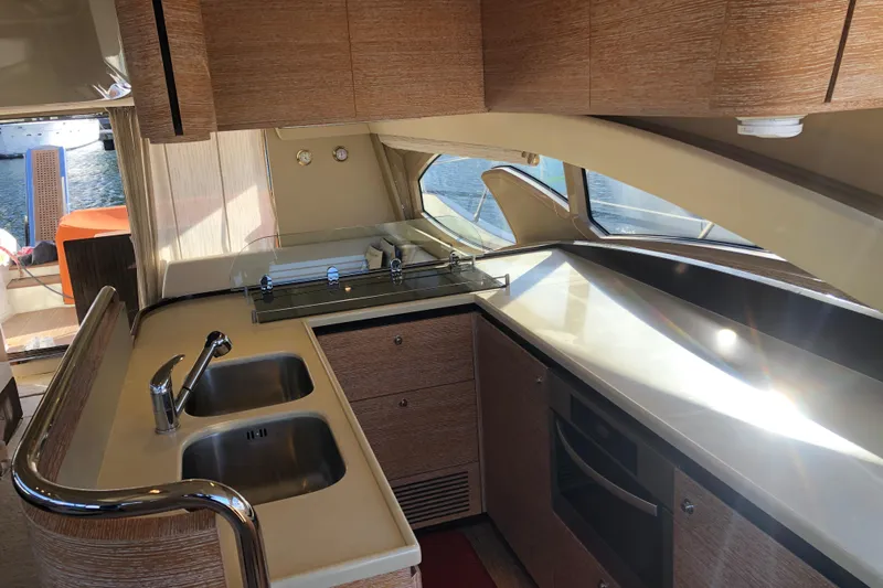  Yacht Photos Pics Luxurious kitchen interior of 2014 Azimut Fly 60 yacht with modern amenities.