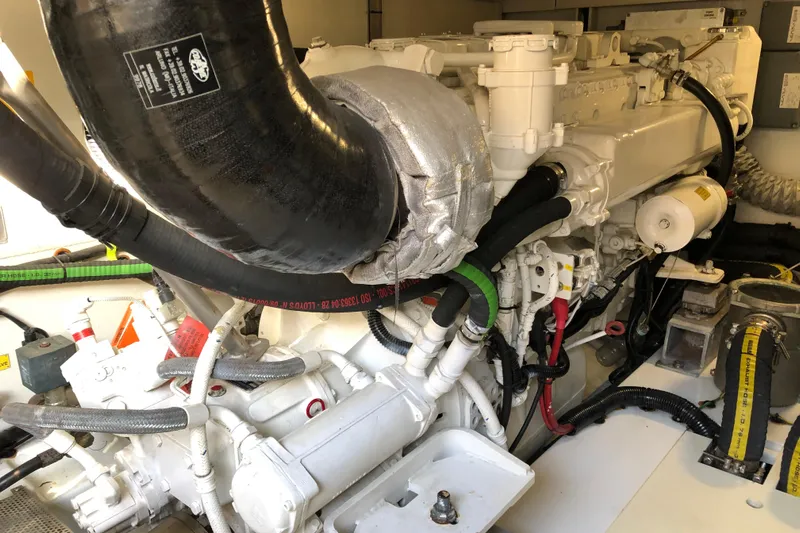  Yacht Photos Pics Engine room of a 2014 Azimut Fly 60 yacht, showcasing complex machinery and components.
