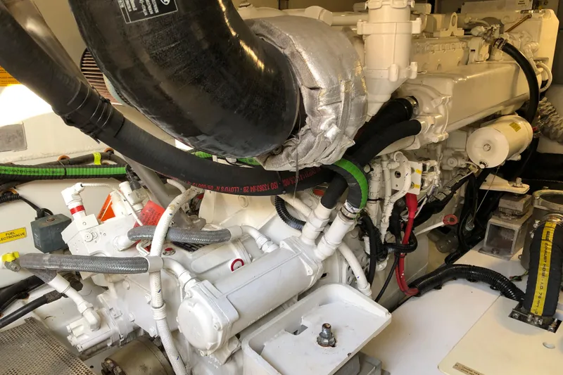  Yacht Photos Pics Engine room of a 2014 Azimut Fly 60 yacht, showcasing complex machinery and components.