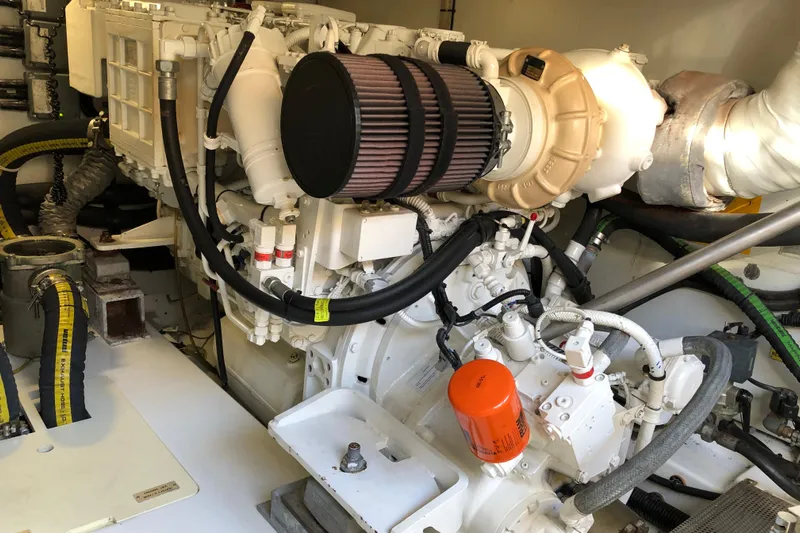  Yacht Photos Pics Engine room of a 2014 Azimut Fly 60 yacht, showcasing mechanical components and hoses.