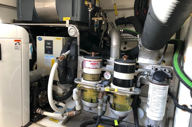  Yacht Photos Pics Engine room of a 2014 Azimut Fly 60 yacht, showcasing mechanical components and systems.