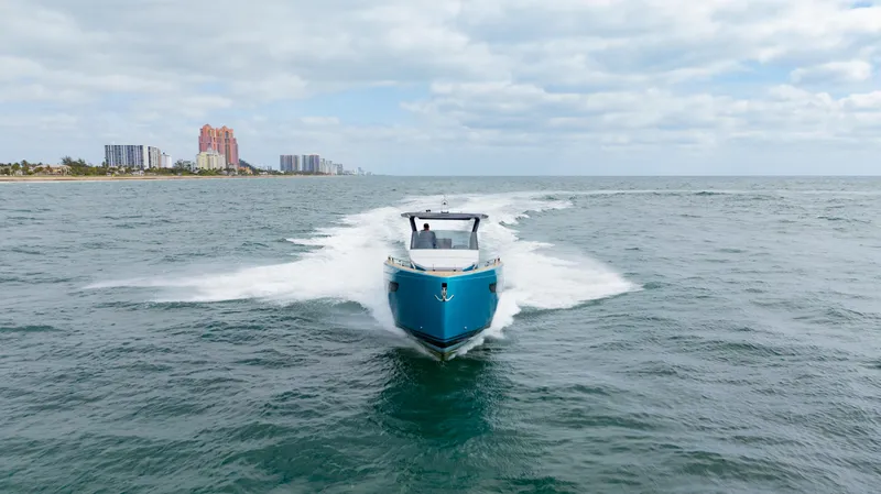 Strade Blu Yacht Photos Pics 2024 Fiart 39 Seawalker cruising on open water with city skyline in background.