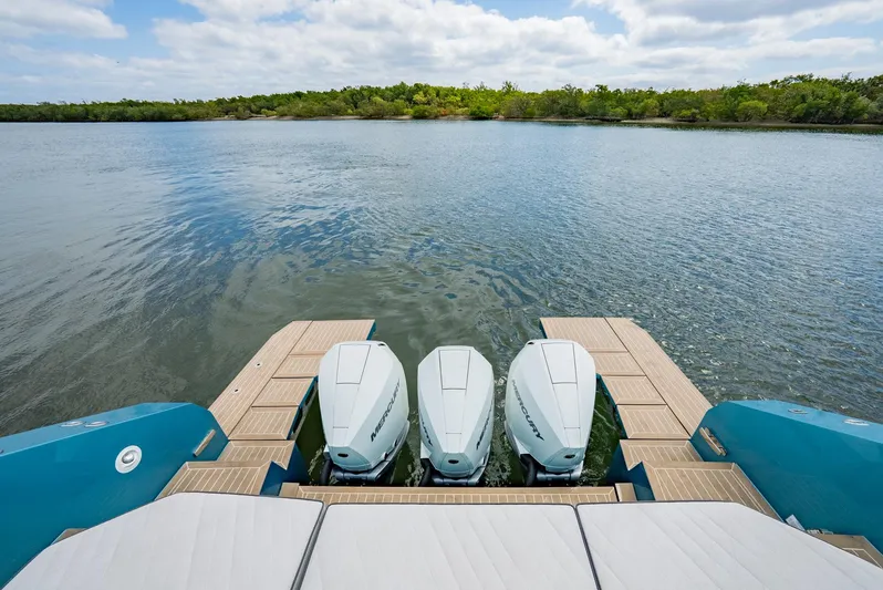 Strade Blu Yacht Photos Pics 2024 Fiart 39 Seawalker with triple outboard engines on a serene water backdrop.