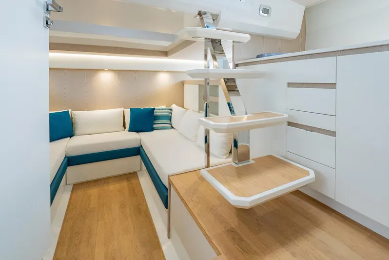 Strade Blu Yacht Photos Pics 2024 Fiart 39 Seawalker interior with modern seating and wooden flooring.