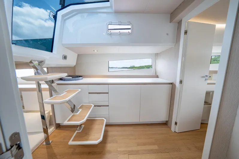 Strade Blu Yacht Photos Pics 2024 Fiart 39 Seawalker interior with modern white cabinetry and wooden flooring.