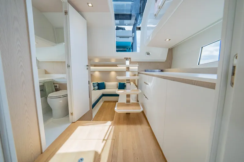 Strade Blu Yacht Photos Pics 2024 Fiart 39 Seawalker interior with modern design, featuring seating area and bathroom.