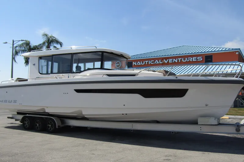  Yacht Photos Pics 2025 Nimbus Commuter 11 boat on trailer at Nautical Ventures dealership.