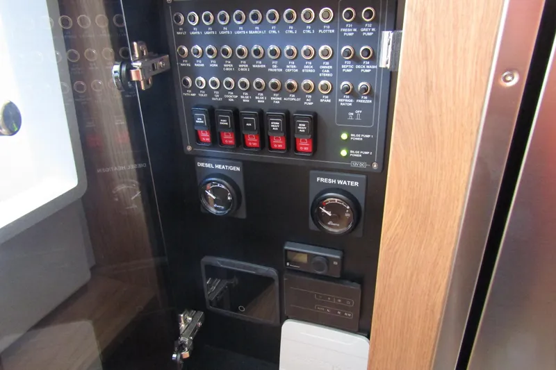  Yacht Photos Pics Electrical control panel of 2025 Nimbus Commuter 11 with switches and gauges.