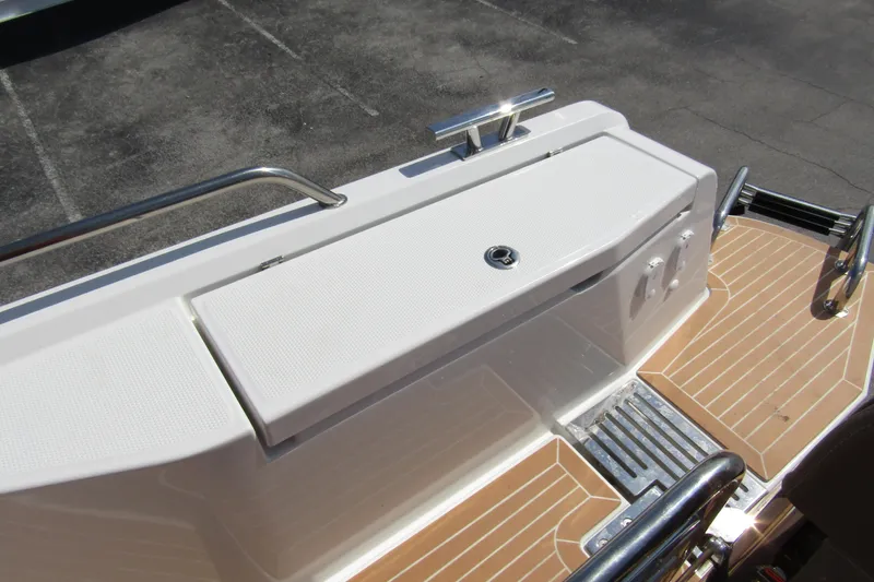  Yacht Photos Pics Rear deck of 2025 Nimbus Commuter 11 boat with sleek design and stainless steel railings.