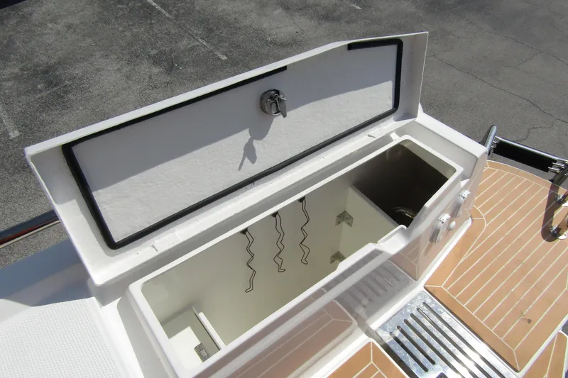  Yacht Photos Pics Open storage compartment on 2025 Nimbus Commuter 11 boat deck.