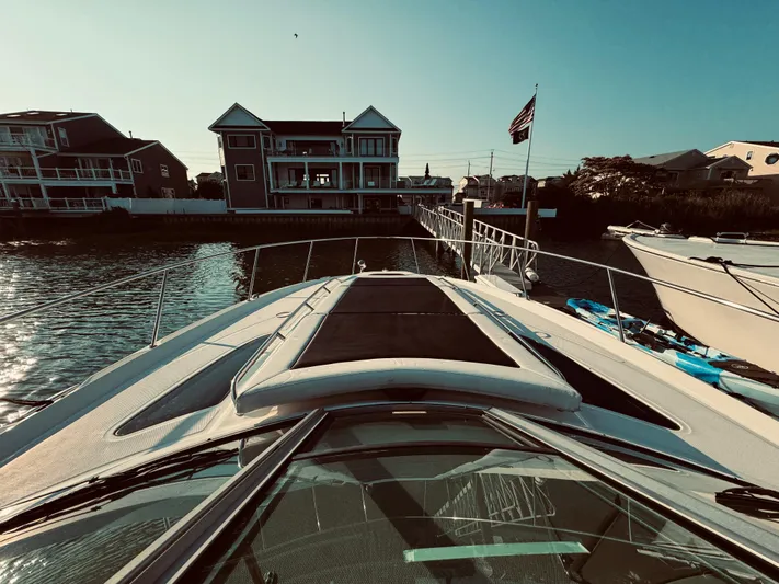 Oasis Yacht Photos Pics 2008 Sea Ray 350 Sundancer docked near waterfront homes.