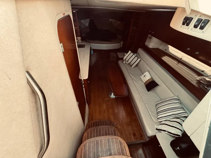 Oasis Yacht Photos Pics 2008 Sea Ray 350 Sundancer cabin interior with seating and wooden flooring.