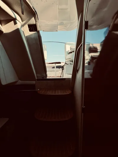 Oasis Yacht Photos Pics Interior view of 2008 Sea Ray 350 Sundancer yacht with steps leading to deck.