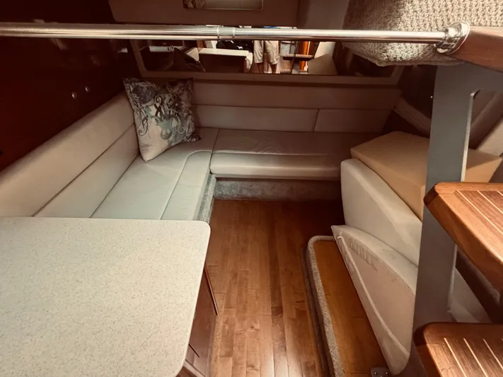 Oasis Yacht Photos Pics Interior of 2008 Sea Ray 350 Sundancer with seating area and wooden flooring.