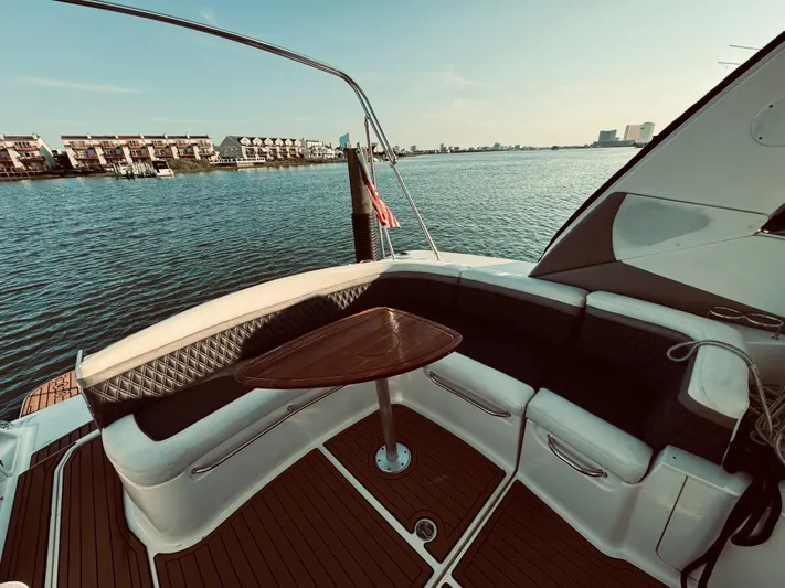 Oasis Yacht Photos Pics 2008 Sea Ray 350 Sundancer boat with a view of the water and cityscape.