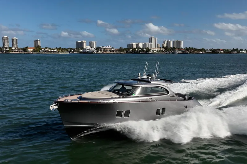 Hope Yacht Photos Pics 2025 Zeelander Z5 yacht cruising on a sunny day near a city skyline.