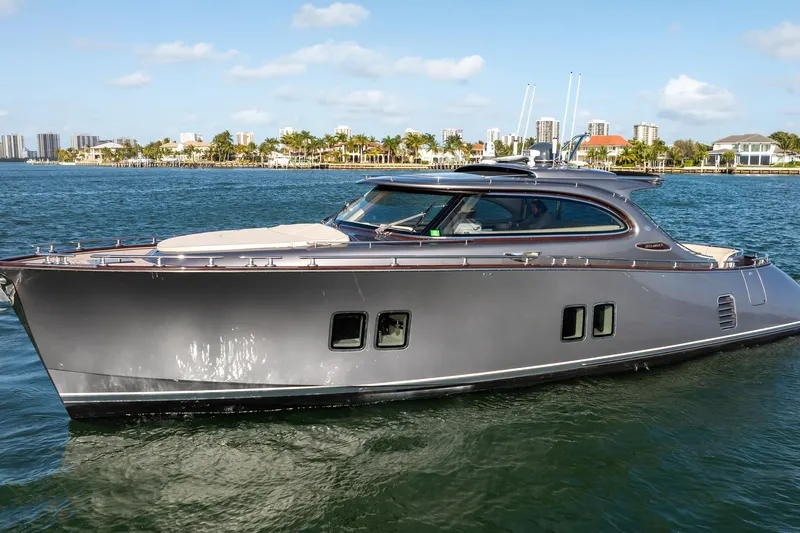 Hope Yacht Photos Pics 2025 Zeelander Z5 yacht cruising on a sunny day with cityscape in the background.