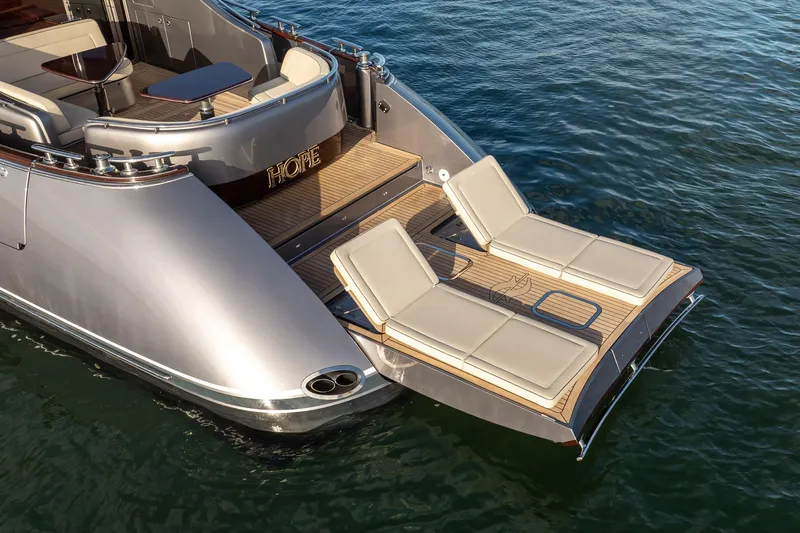 Hope Yacht Photos Pics 2025 Zeelander Z5 yacht with luxurious sun loungers on the deck, floating on water.