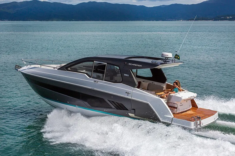  Yacht Photos Pics 2025 Schaefer 380 yacht cruising on open water, showcasing sleek design and luxury features.