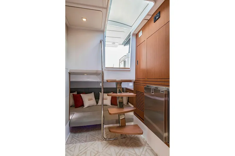  Yacht Photos Pics Interior of 2025 Schaefer 380 yacht with modern staircase and cozy seating area.